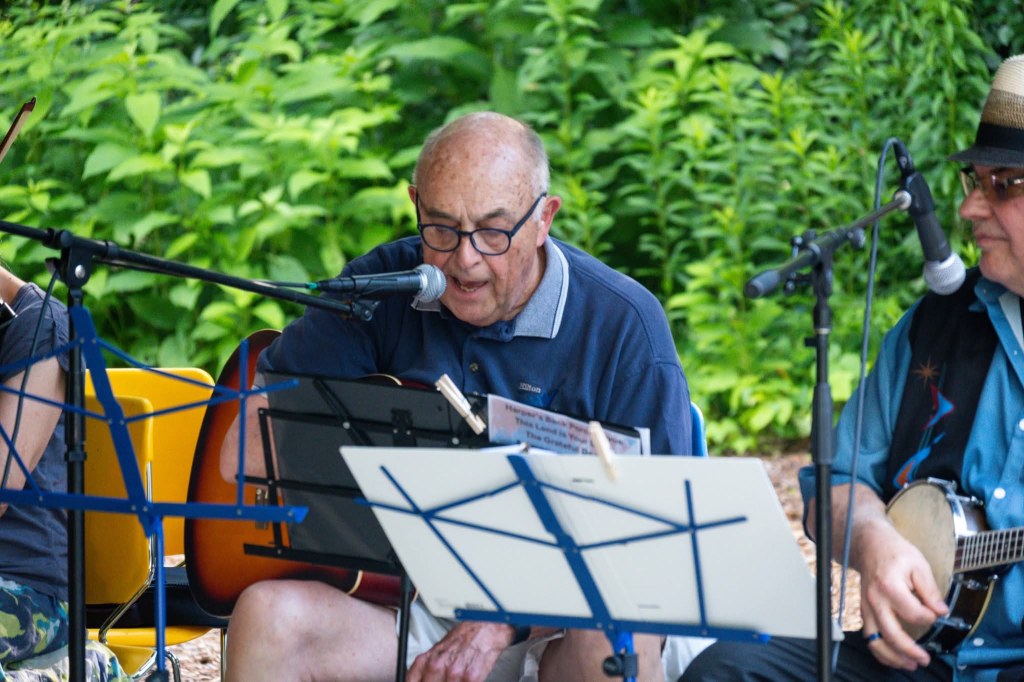 Singer in the Back Porch Revue playing at the Spring Valley Nature Center, June 2025